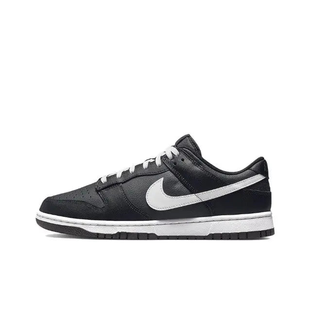 Low-top sneaker in black with white Swoosh and lace-up front