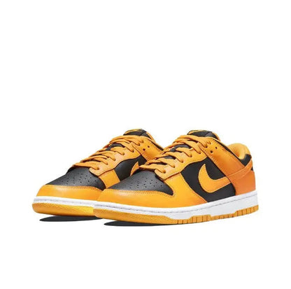 Low-top sneakers side-by-side, orange leather with black Swoosh and white sole