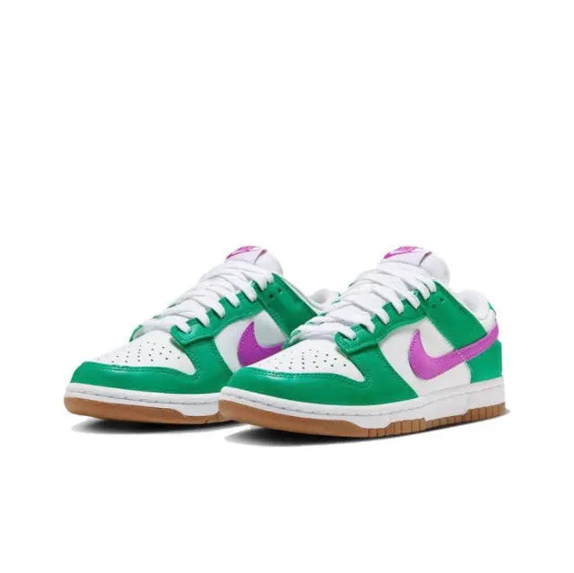 Pair of low-top sneakers in green and white with purple swoosh and gum soles.