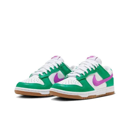 Pair of low-top sneakers in green and white with purple swoosh and gum soles.