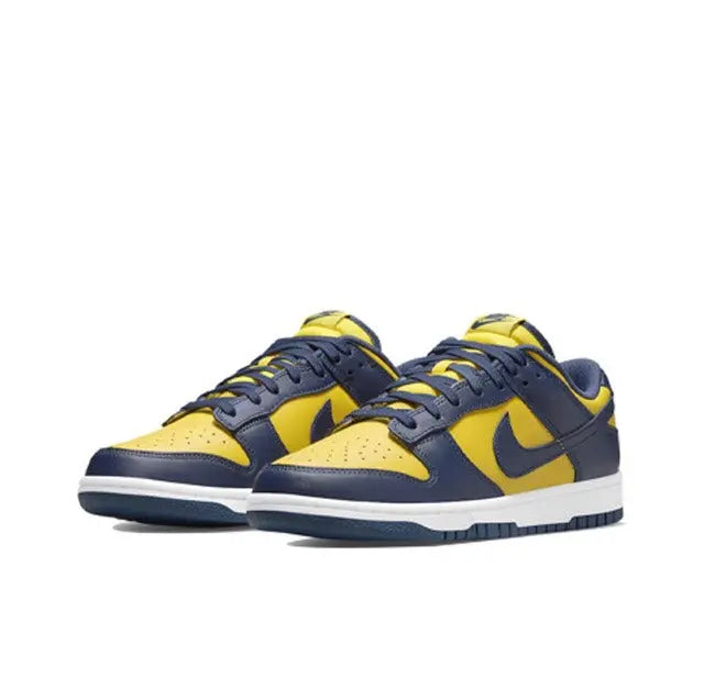Low-top sneakers, navy with maize overlays, yellow swoosh, white midsole