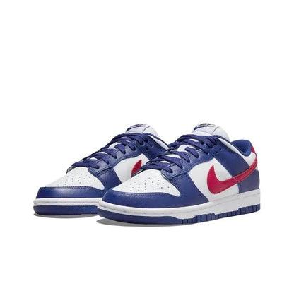 Low-top sneakers, blue with white toe panels and red Nike swoosh, lace-up design.