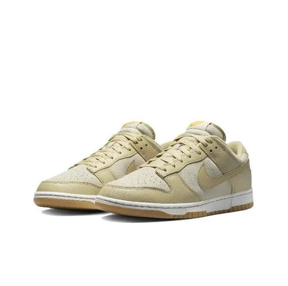 Nike Dunk Low low-top sneakers, light beige upper with tan Swoosh and gum sole