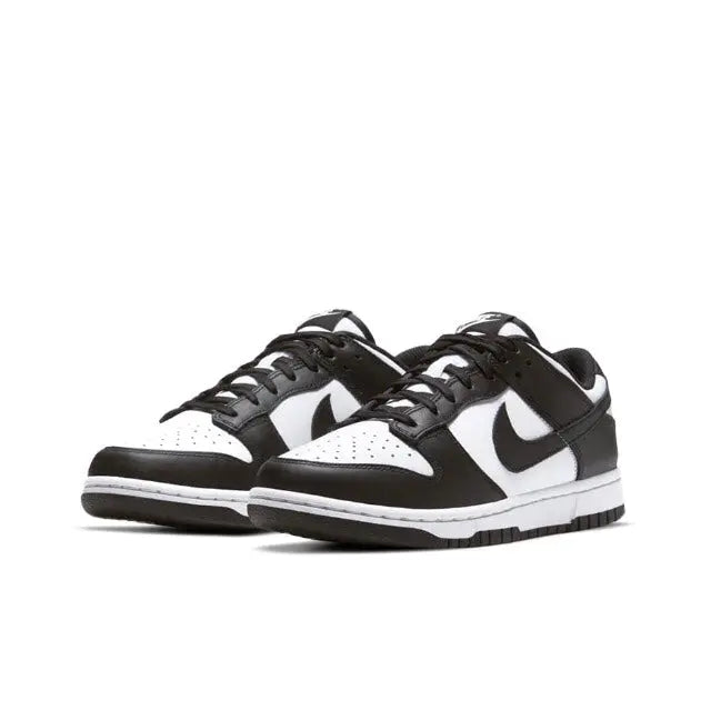 Nike Dunk Low low-top sneakers in black and white, angled front view with swooshes