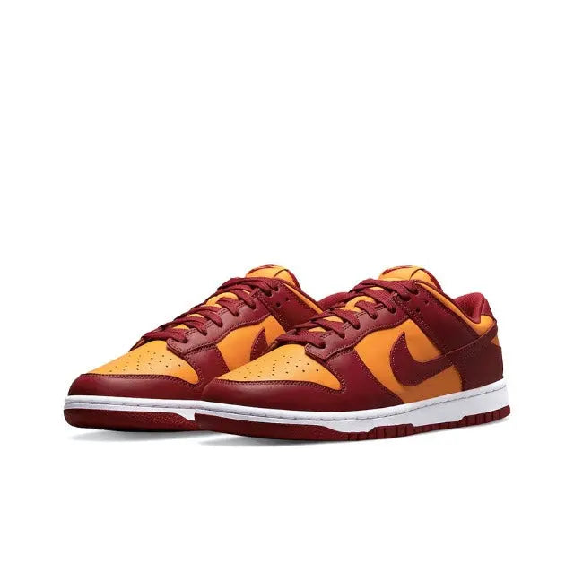 Low-top sneakers in burgundy and gold with yellow toe, Nike swoosh, white sole