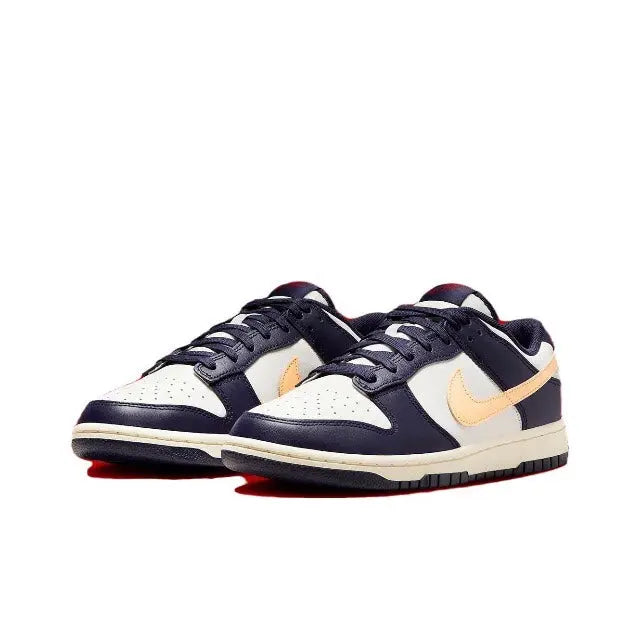 Low-top sneakers in navy blue and white with beige Swoosh and lace-up vamp