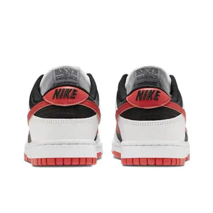 Low-top sneaker heel view with white upper, black collar, and red trim