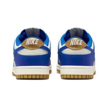 Low-top sneakers back view with Nike logo on blue heel, sail base, gum sole