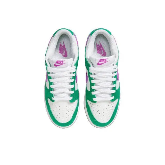 Low-top sneakers: green and white uppers with white laces and purple Nike tongue logo.