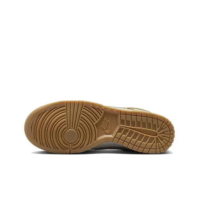 Nike Dunk Low sneaker outsole view with gum tread and grid pattern