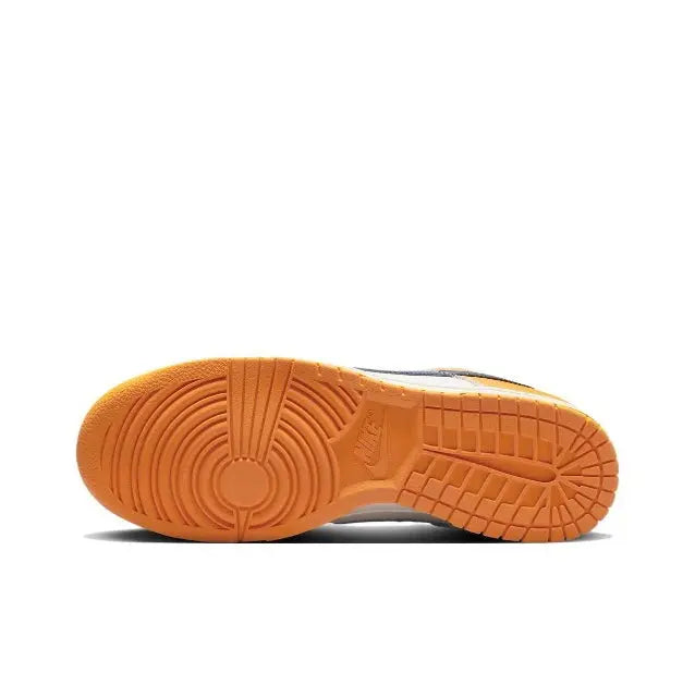 Low-top sneakers outsole view with orange rubber tread