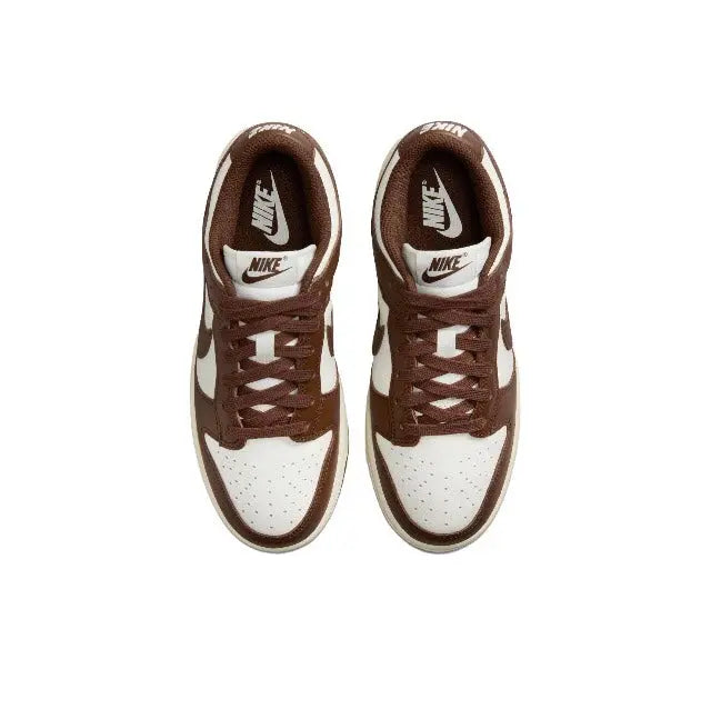 Nike Dunk Low sneakers, lace-up front view, brown uppers with white toe box