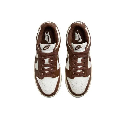 Nike Dunk Low sneakers, lace-up front view, brown uppers with white toe box
