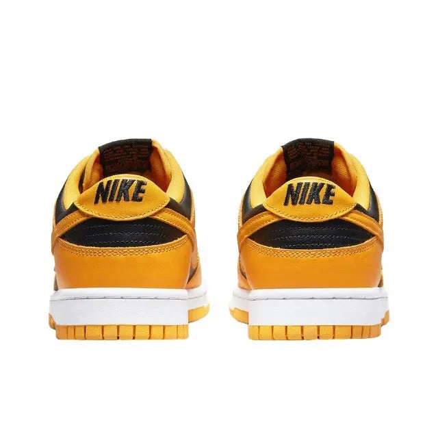 Low-top sneakers heel view, black collar lining, orange uppers, white midsole