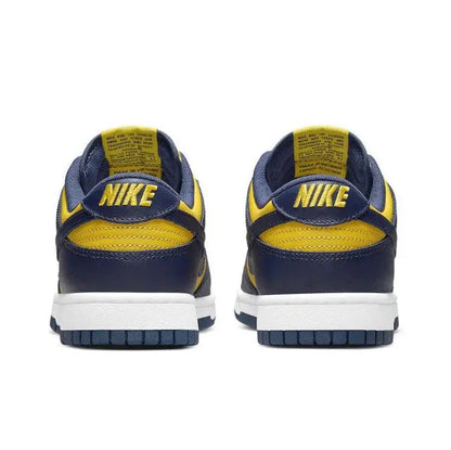 Low-top sneakers heels in navy with yellow NIKE branding and white midsole