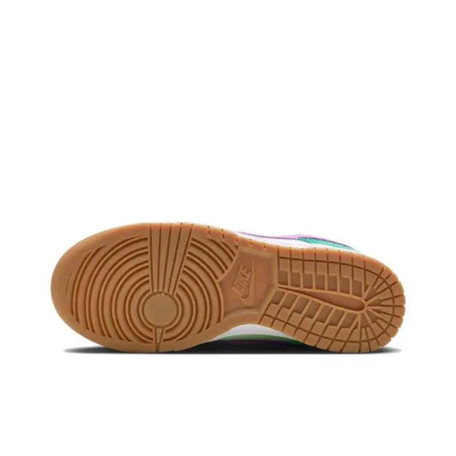 Low-top sneakers outsole with gum rubber tread and brown heel branding detail.