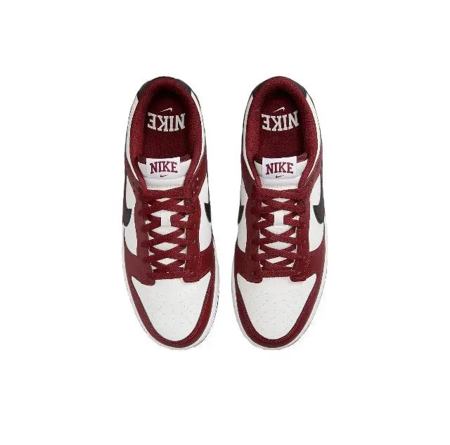 Low-top sneakers with burgundy and white uppers and lace-up eyelets