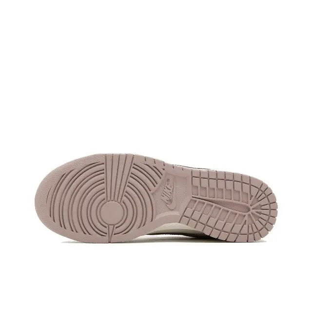 Nike Dunk Low sneaker outsole, mauve rubber tread with circular traction pattern