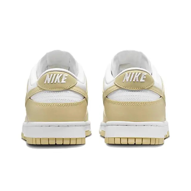 Nike Dunk Low low-top sneaker, white back with light gold heel panel and Nike text