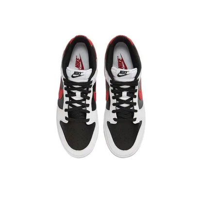 Low-top sneaker pair with white leather, black panels, red logo accents, and black laces