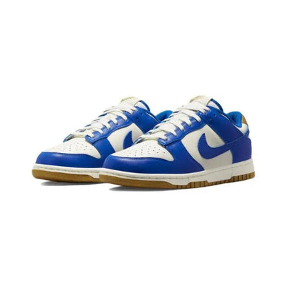 Low-top sneakers pair side view, blue uppers, sail overlays, blue swoosh, gum sole