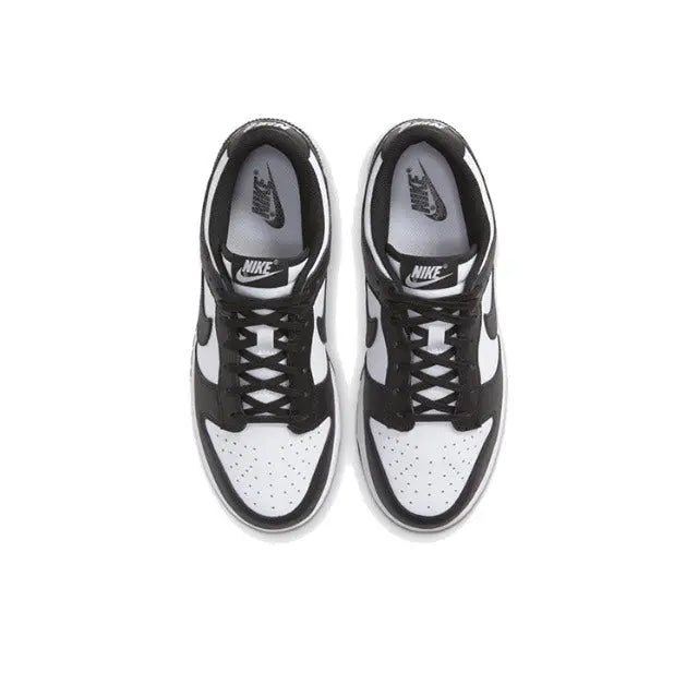 Nike Dunk Low sneakers top view, black laces with white toe panels and swooshes