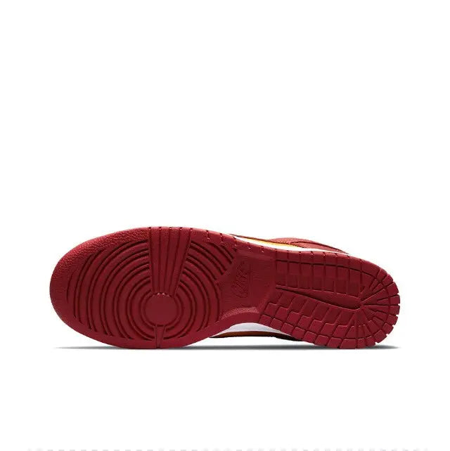 Low-top sneaker outsole with burgundy traction tread and white midsole edge