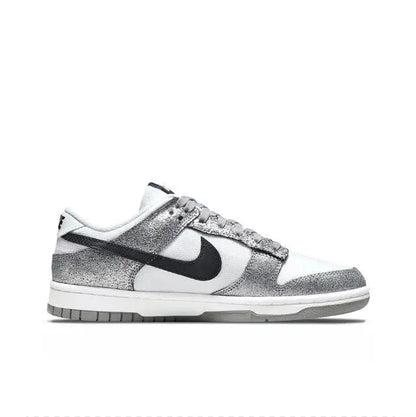 Low-top sneaker side profile, white upper with silver speckle and black swoosh