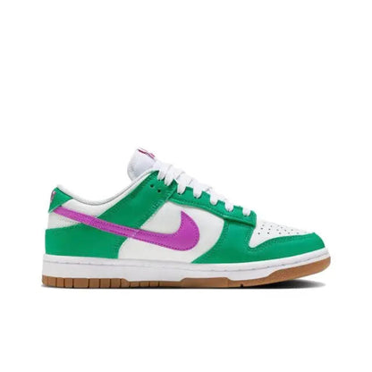 Low-top sneakers with green upper, white midsole, purple swoosh, and white laces.
