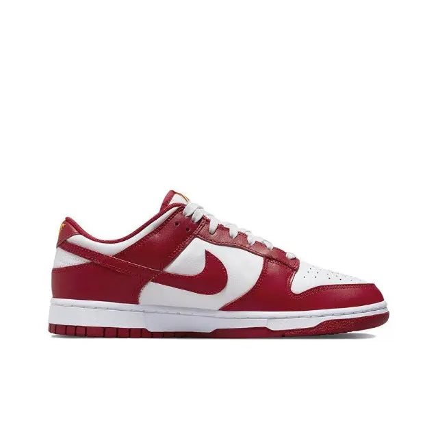 Nike Dunk Low low-top sneakers in red with white toe box, Swoosh, and lace-up front