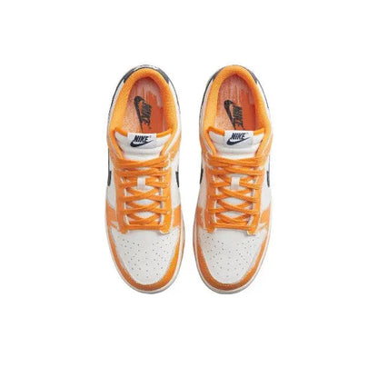 Low-top sneakers tongue and lace view, sail uppers with orange laces and navy accents