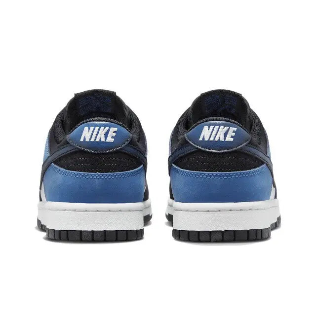 Nike Dunk Low low-top sneakers, heel view with blue panels, black collar, white midsole