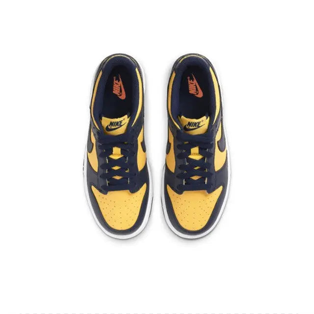 Low-top sneakers pair, navy and maize colorblocking with white midsoles