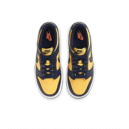 Low-top sneakers pair, navy and maize colorblocking with white midsoles