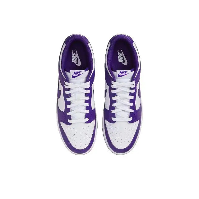 Nike Dunk Low low-top sneaker front view, white laces and court purple accents.