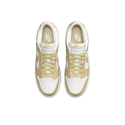 Nike Dunk Low low-top sneaker, white and light gold upper with laces and tongue