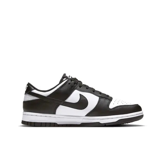 Nike Dunk Low low-top sneakers in black and white, front side view with swoosh