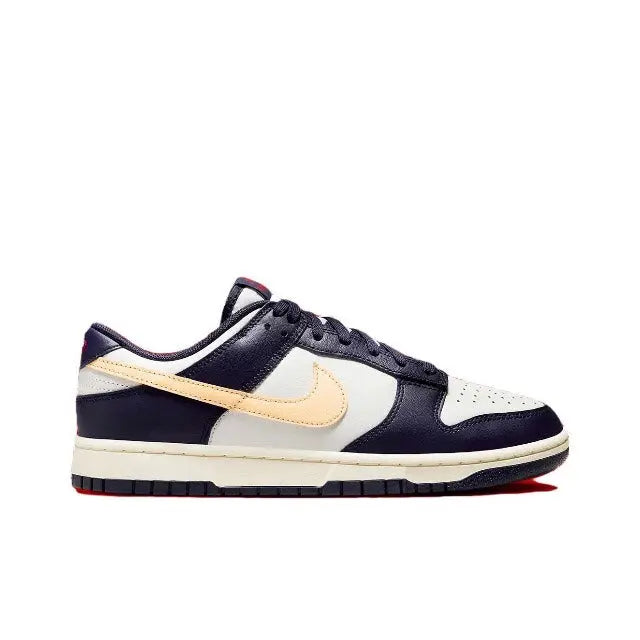 Low-top sneakers side view in navy blue, white, and beige with lace-up closure