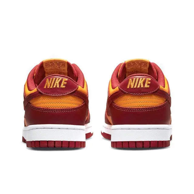 Low-top sneakers with Nike heel label, burgundy uppers, gold accents, white sole