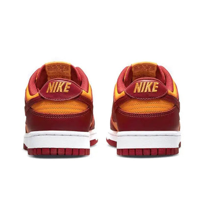 Low-top sneakers with Nike heel label, burgundy uppers, gold accents, white sole