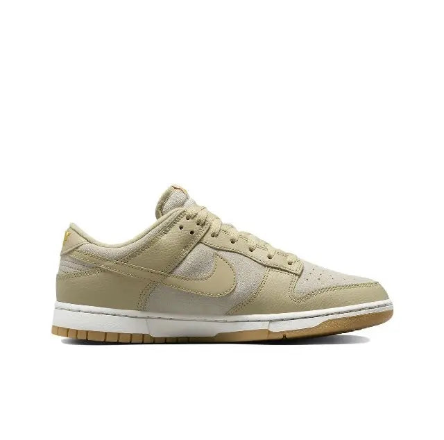Nike Dunk Low low-top sneakers in light beige leather with tan overlays and gum sole
