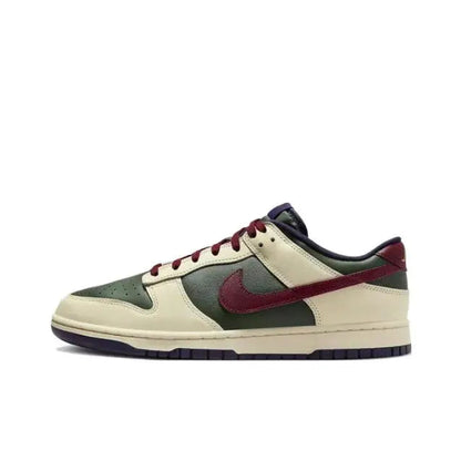 Low-top sneakers side profile: cream, dark green panels, burgundy swoosh, red laces.