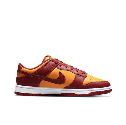 Low-top sneakers side profile in burgundy, gold, and yellow with Nike swoosh