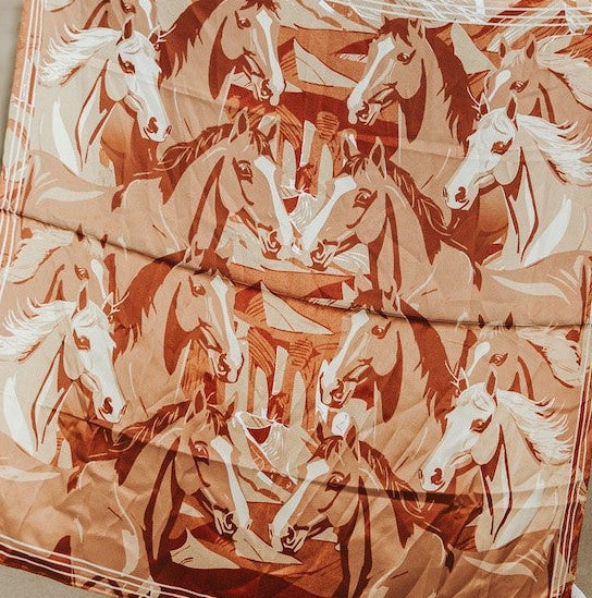 Wild rag scarf with horse collage in rust, tan, and cream, folded with soft folds