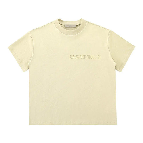 Light yellow T-shirt with 'ESSENTIALS' chest logo