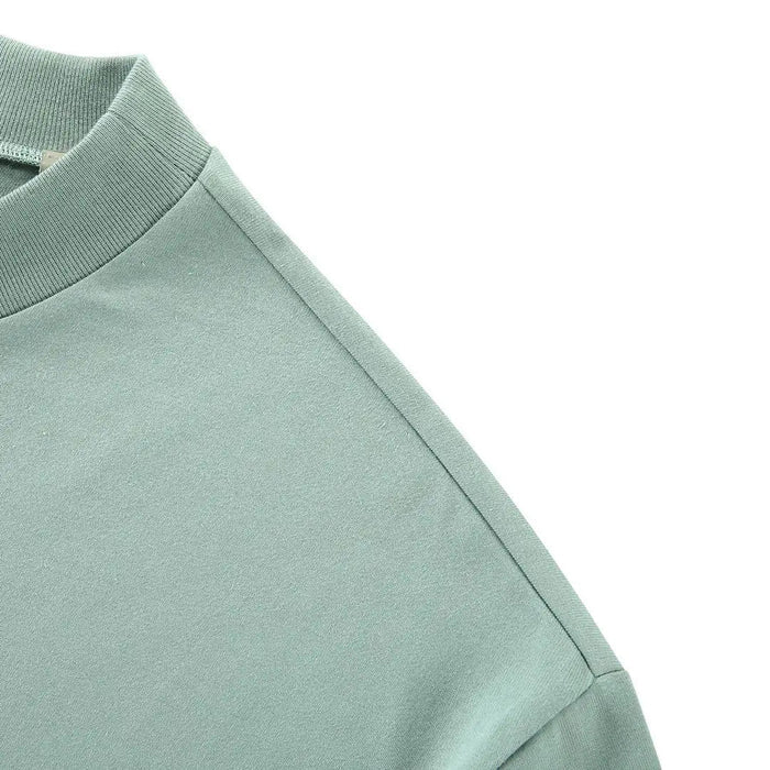Light blue T-shirt shoulder seam and sleeve hem detail