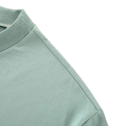 Light blue T-shirt shoulder seam and sleeve hem detail