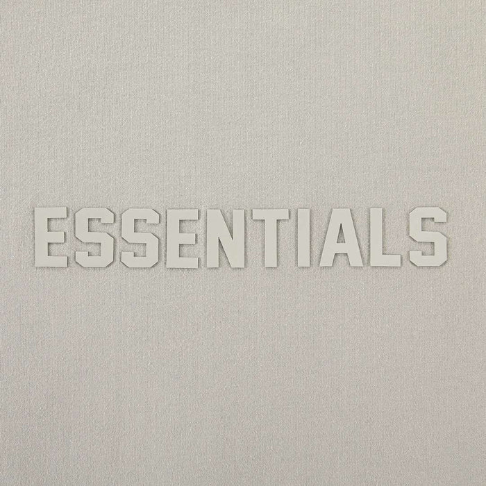 Essentials T-shirt front logo close-up with raised ESSENTIALS lettering