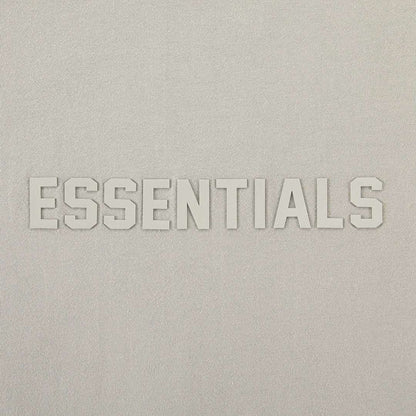 Essentials T-shirt front logo close-up with raised ESSENTIALS lettering