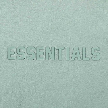 Light blue T-shirt with raised ESSENTIALS wordmark logo